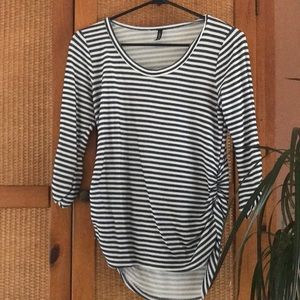 Long sleeved striped shirt. Price reflects worn